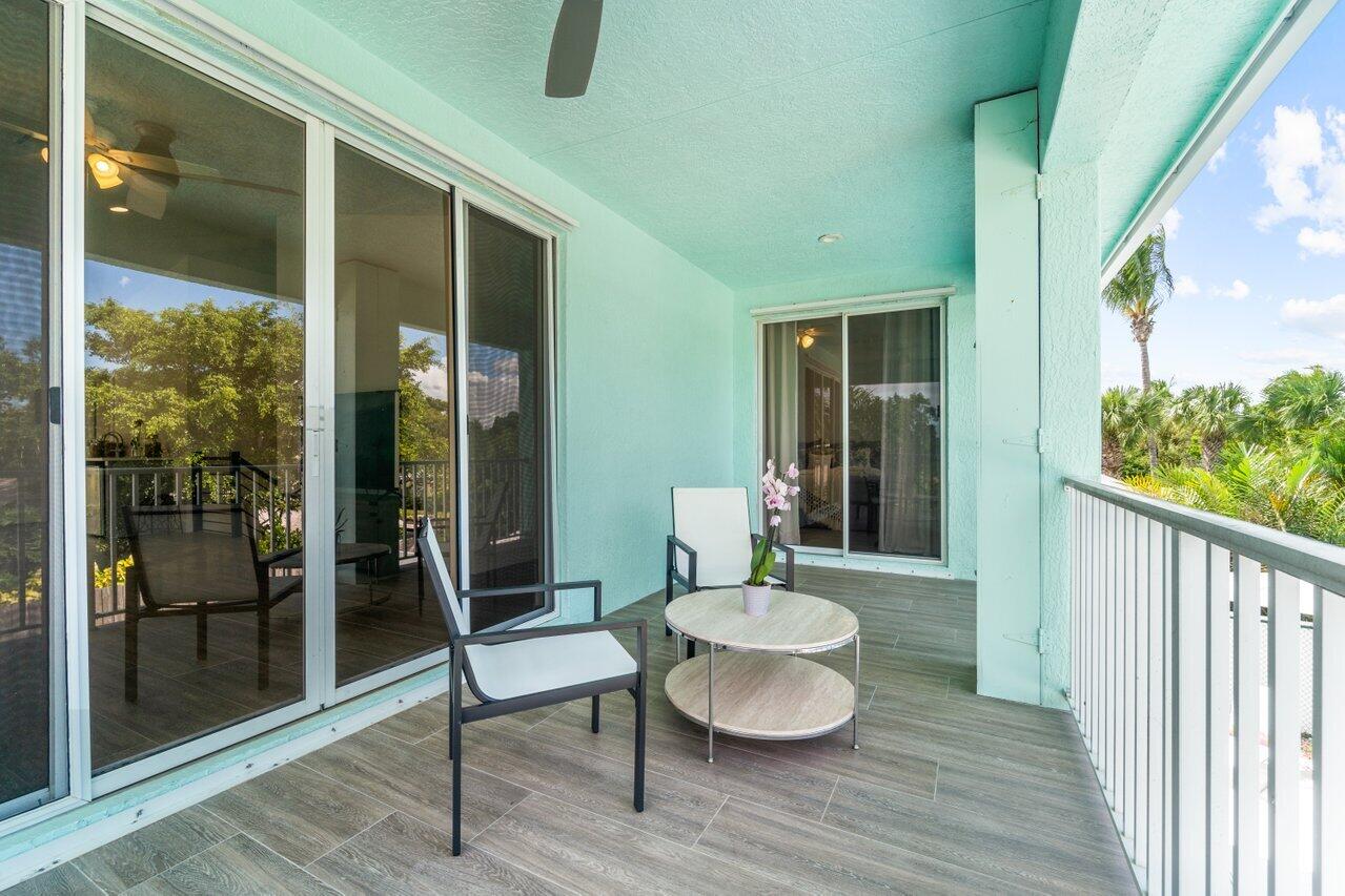 9427 Southeast Athena Street Hobe Sound, FL 33455 - Photo 15 of 33 Second floor balcony overlooking pool