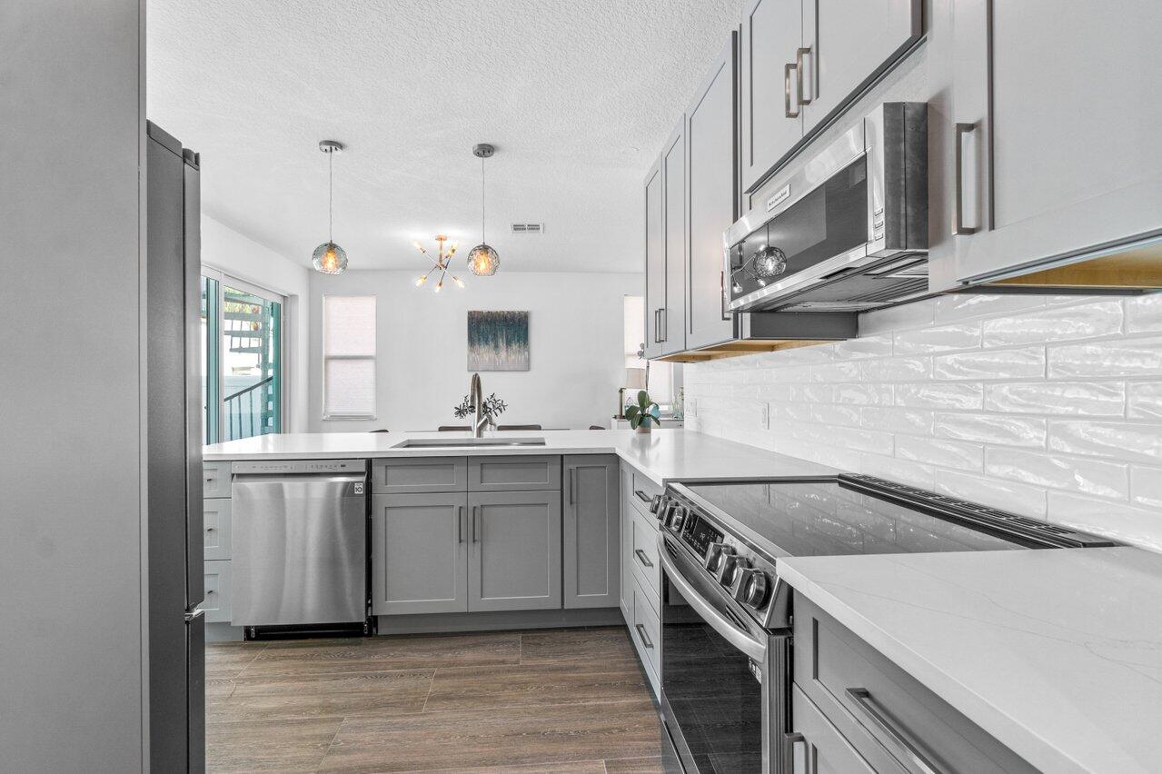 9427 Southeast Athena Street Hobe Sound, FL 33455 - Photo 7 of 33 Kitchen1