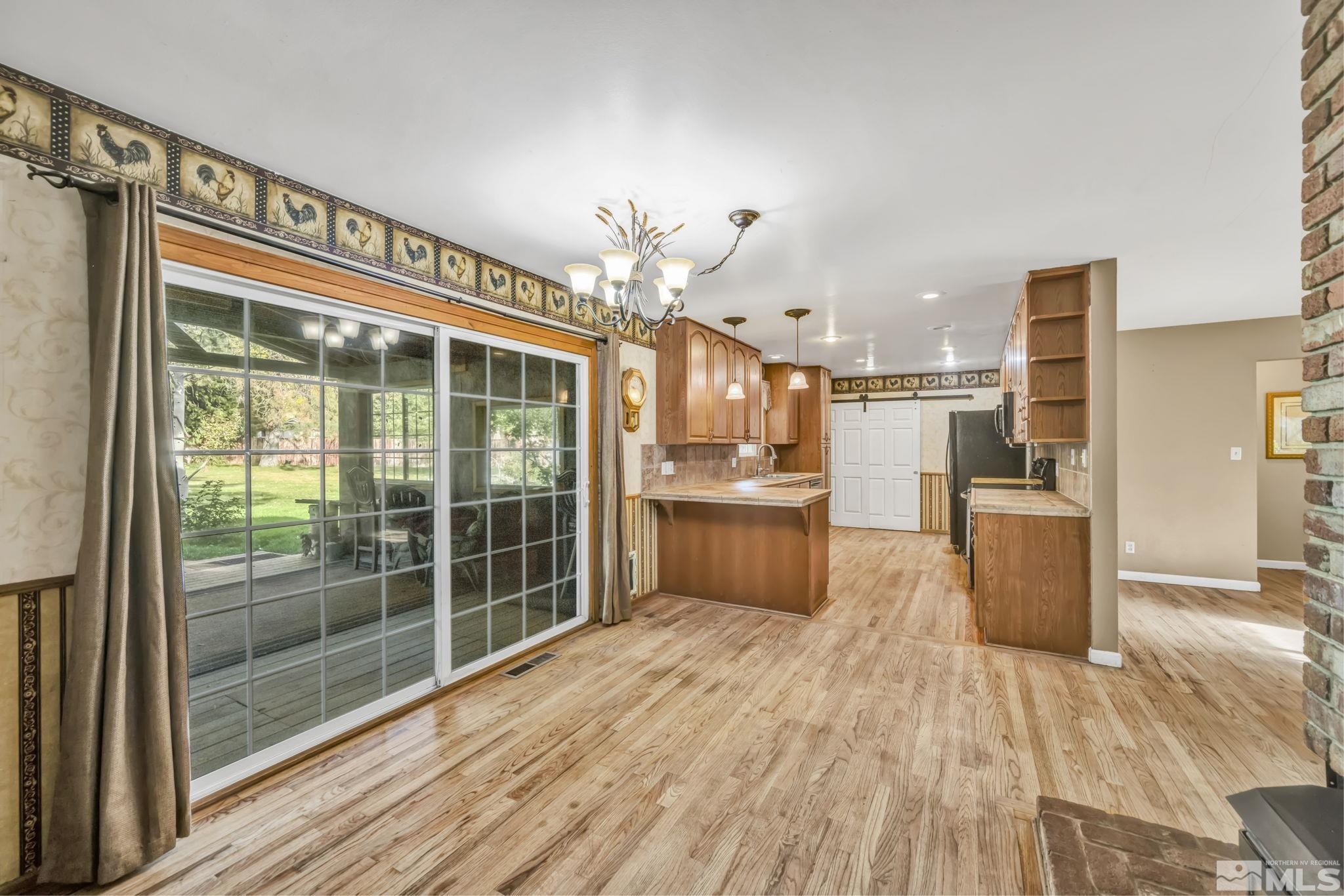 55 Surrey Drive Reno, NV 89521 - Photo 15 of 40 a view of a kitchen with wooden floor and a kitchen