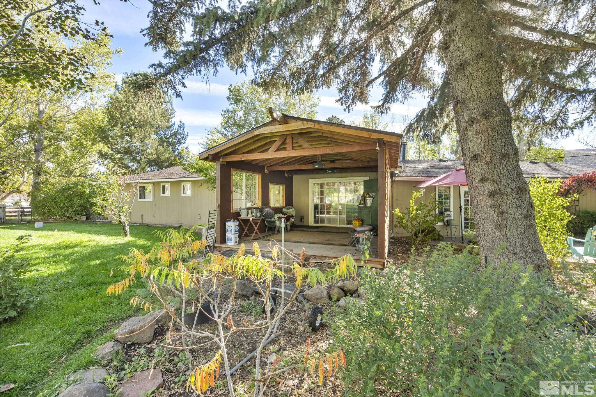 55 Surrey Drive Reno, NV 89521 - Photo 26 of 40 a front view of a house with garden