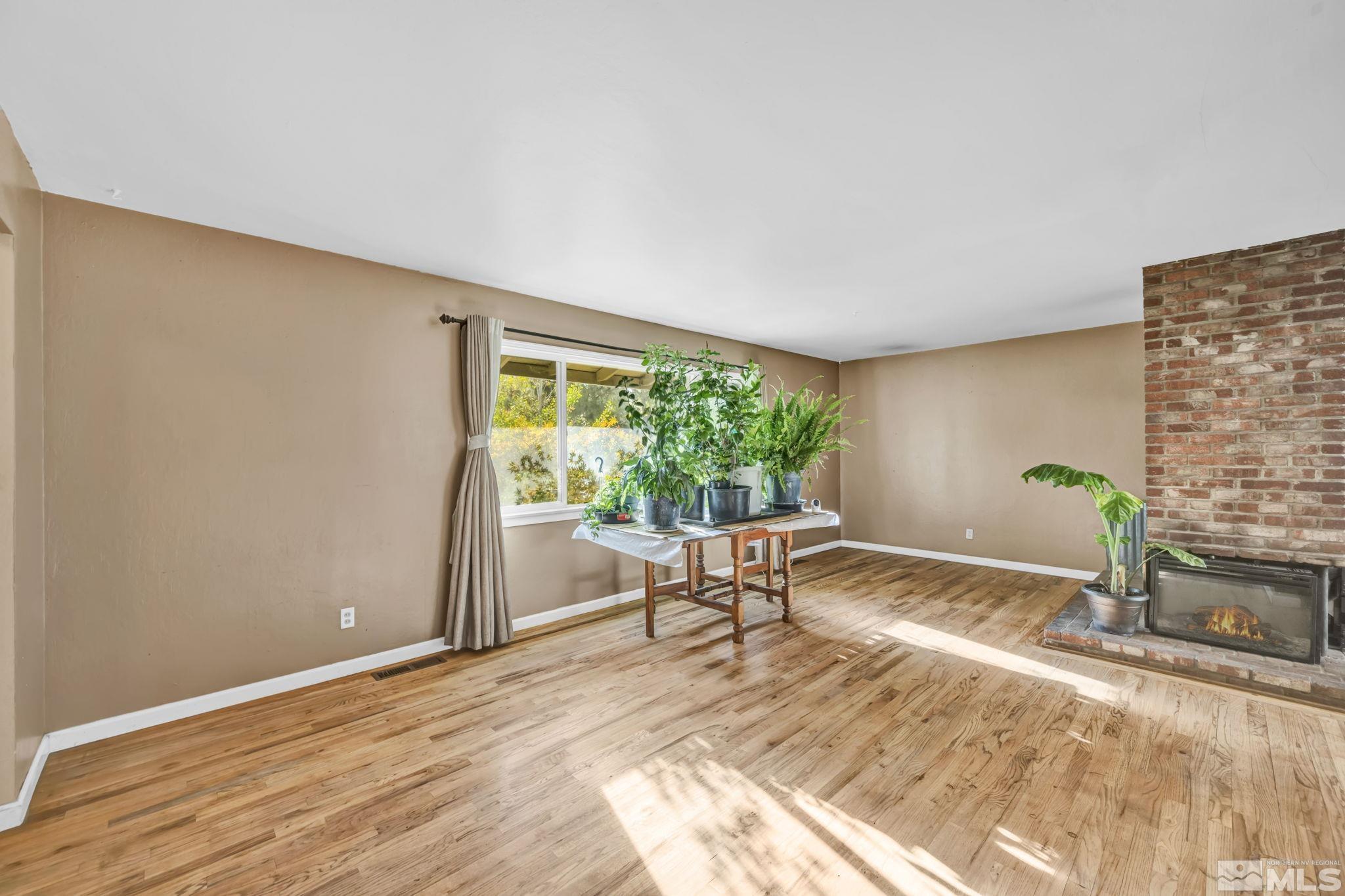 55 Surrey Drive Reno, NV 89521 - Photo 3 of 40 a living room with furniture and a fireplace