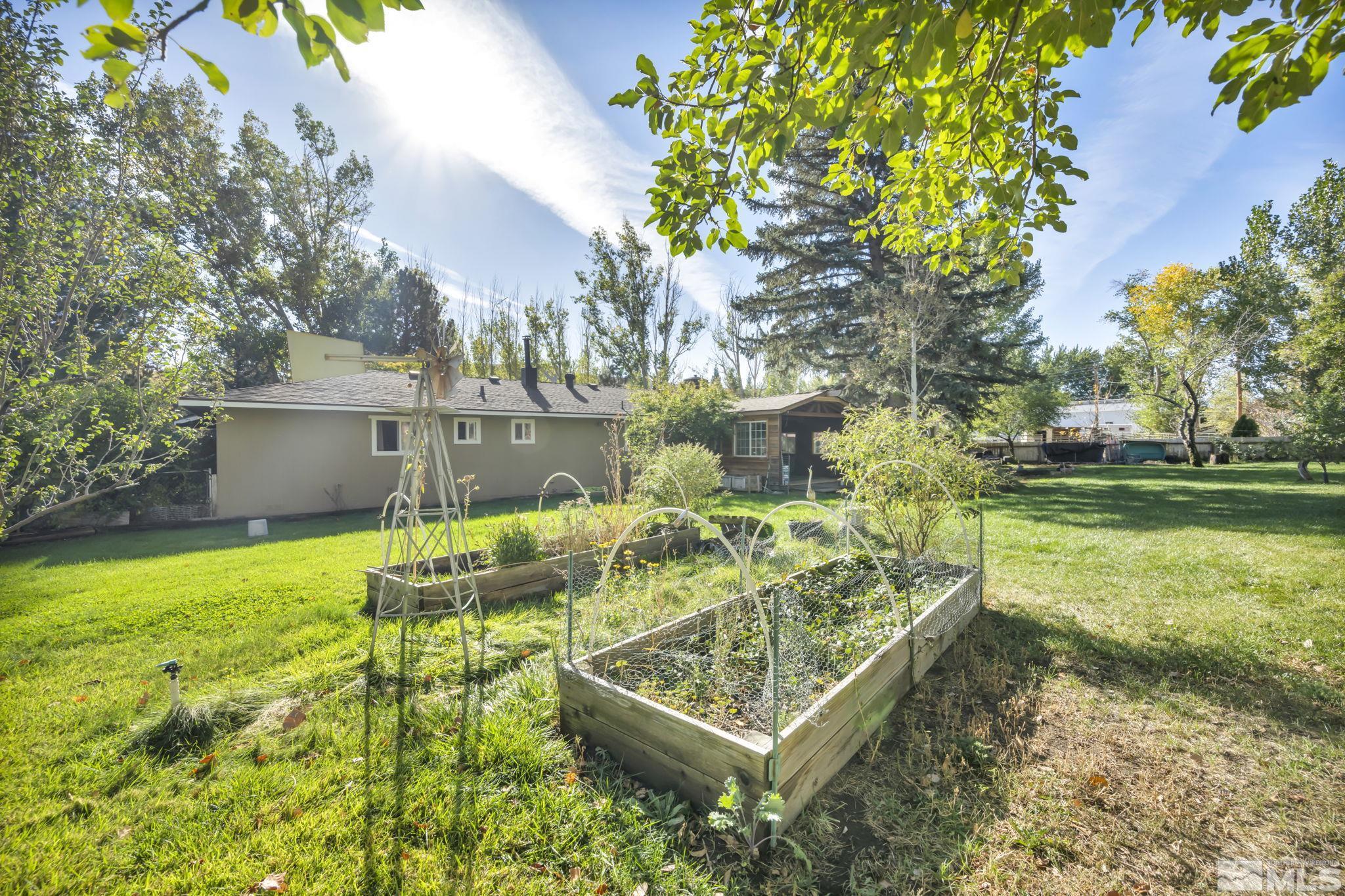 55 Surrey Drive Reno, NV 89521 - Photo 38 of 40 a view of a yard with table and chairs