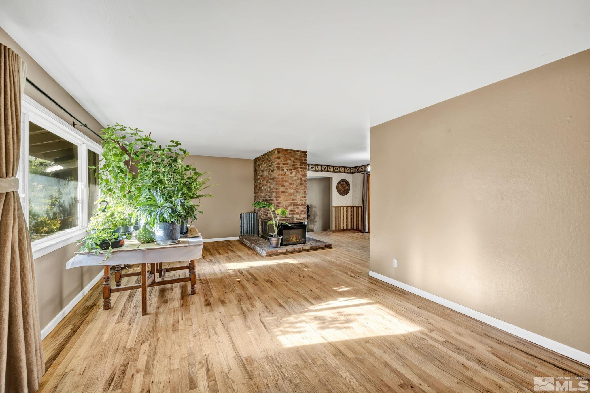 55 Surrey Drive Reno, NV 89521 - Photo 4 of 40 a living room with furniture and a table