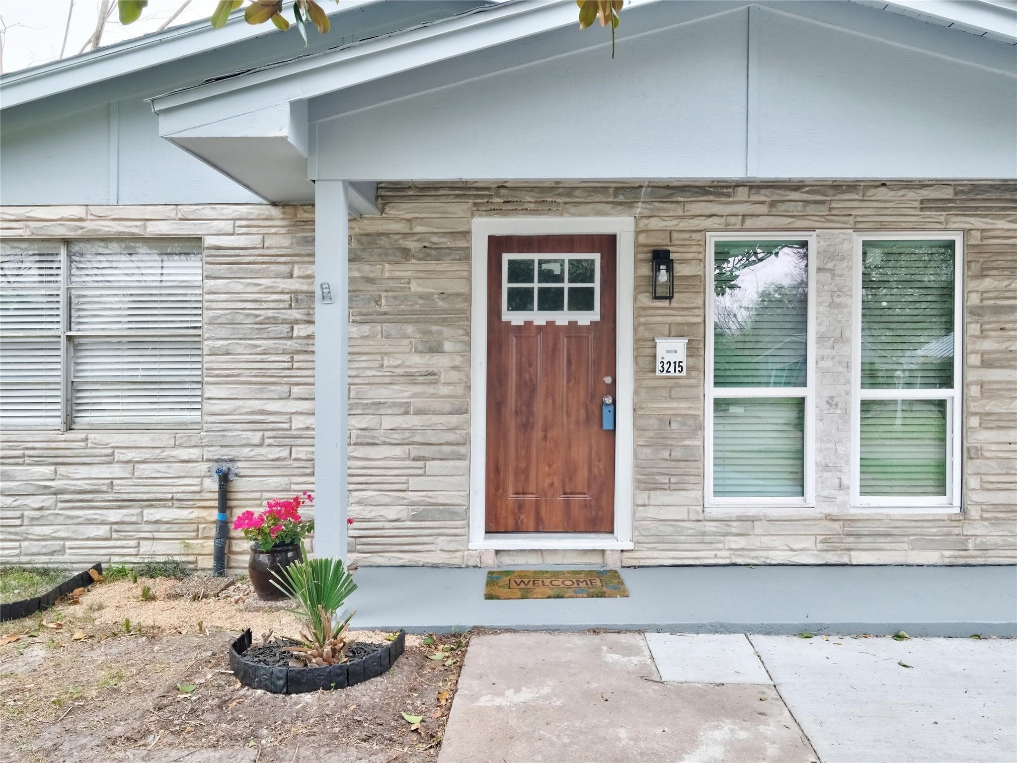 3215 Soway Street Houston, TX 77080 - Photo 21 of 29 a front view of a house with a potted plant