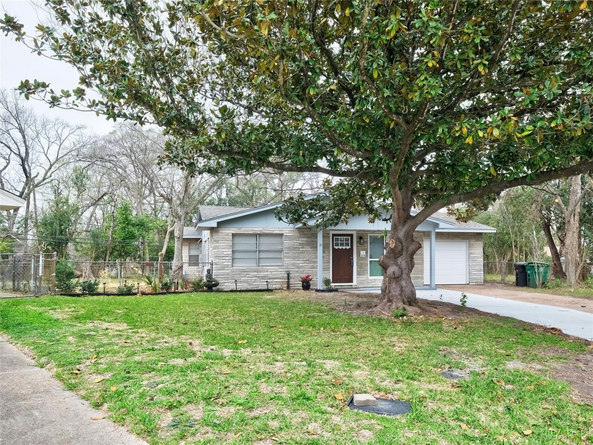 3215 Soway Street Houston, TX 77080 - Photo 29 of 29 a front view of house with yard and green space