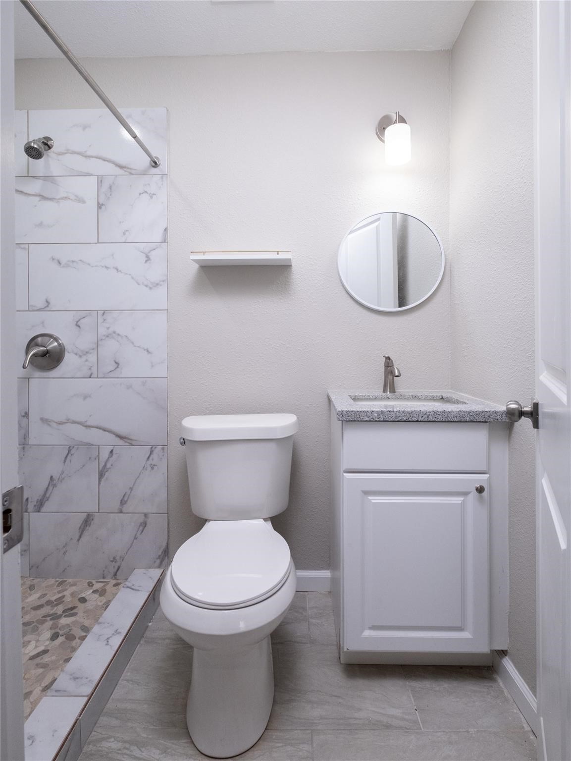 3215 Soway Street Houston, TX 77080 - Photo 9 of 29 a bathroom with a toilet sink and vanity