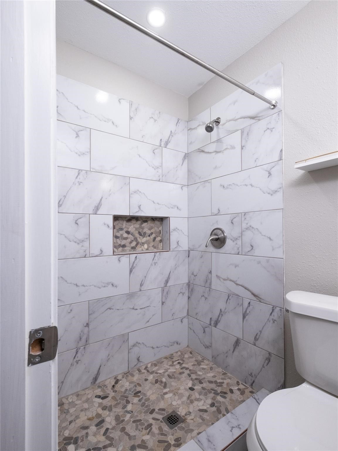 3215 Soway Street Houston, TX 77080 - Photo 10 of 29 a bathroom with a toilet and a shower