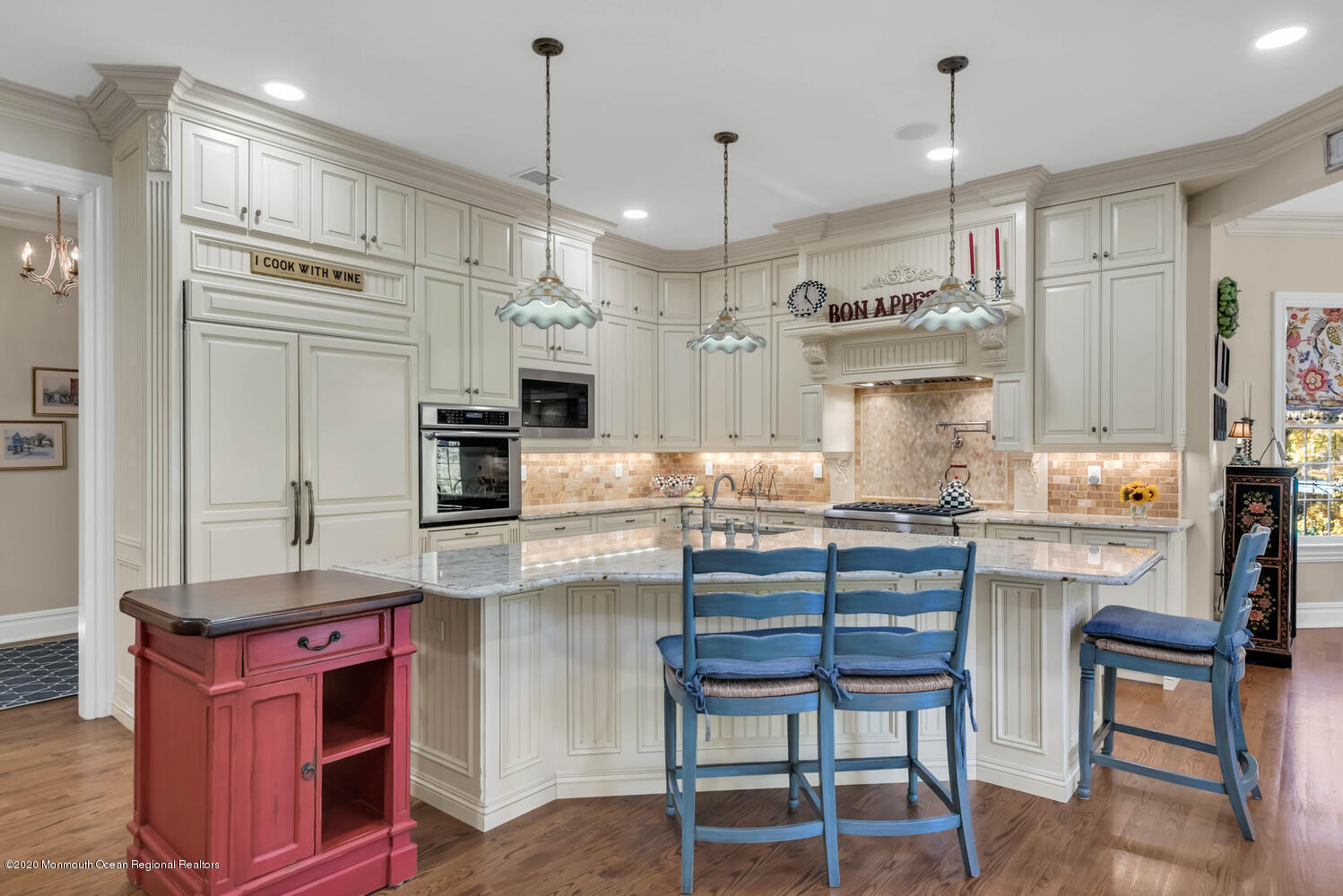 280 Portland Road Atlantic Highlands, NJ 07716 - Photo 18 of 74 a kitchen with kitchen island granite countertop a table chairs refrigerator and microwave