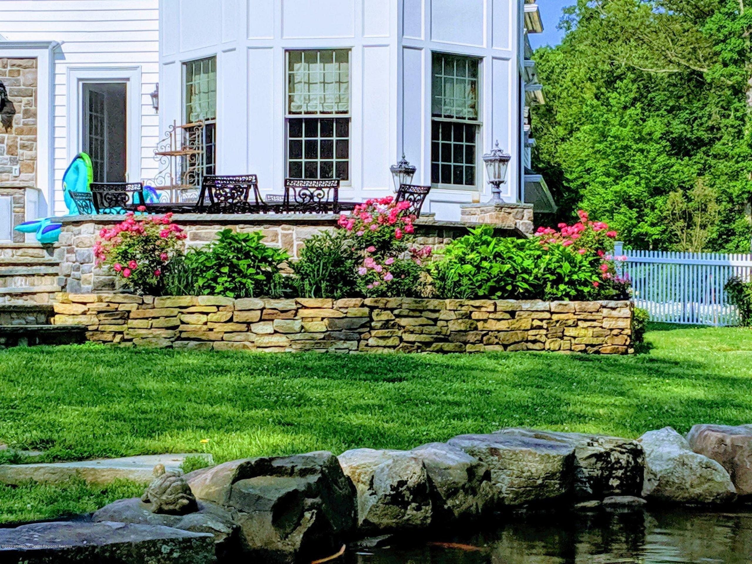 280 Portland Road Atlantic Highlands, NJ 07716 - Photo 62 of 74 a view of a house with a backyard and garden