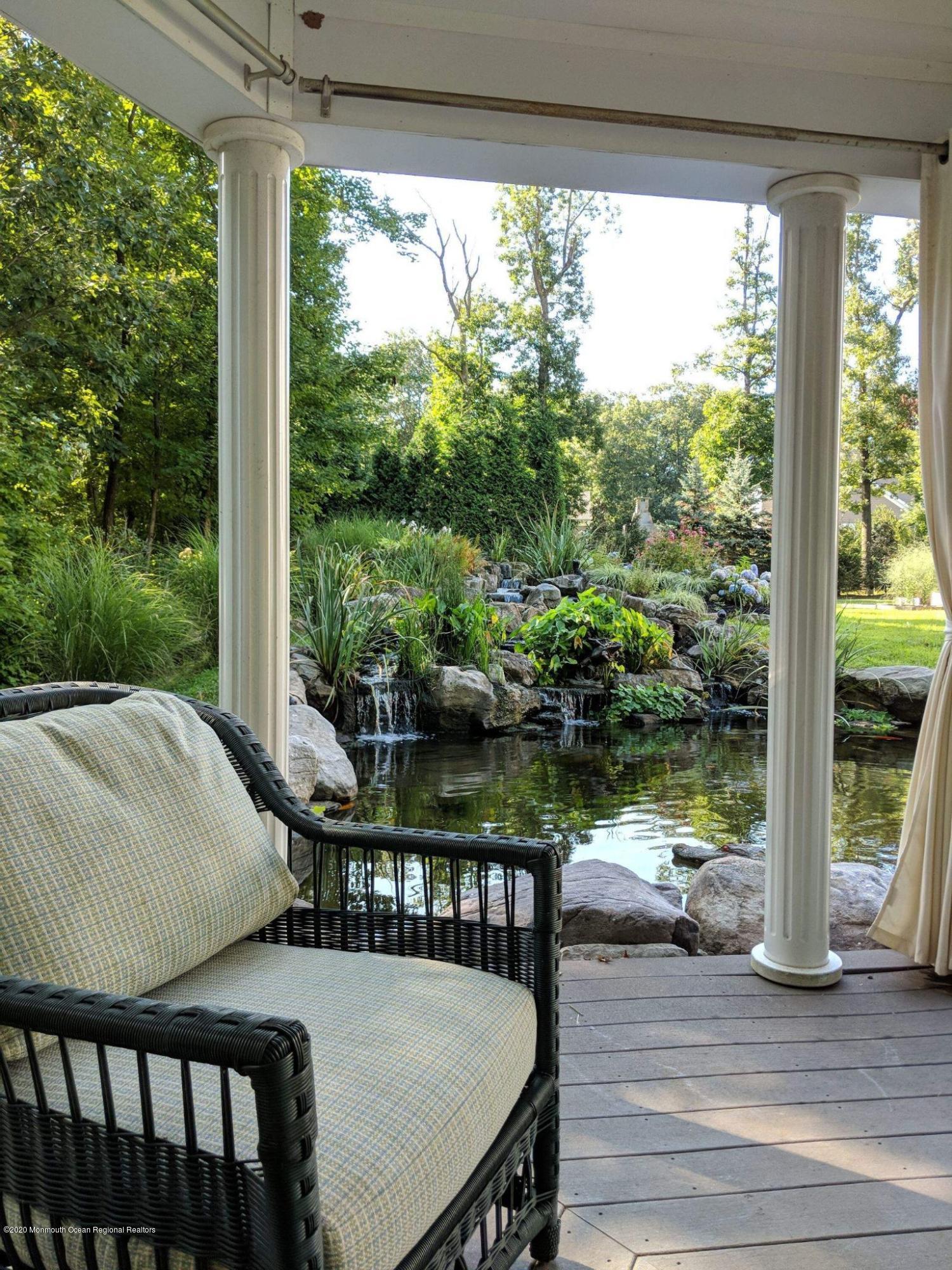 280 Portland Road Atlantic Highlands, NJ 07716 - Photo 67 of 74 a view of a chairs and table in patio with a lake view