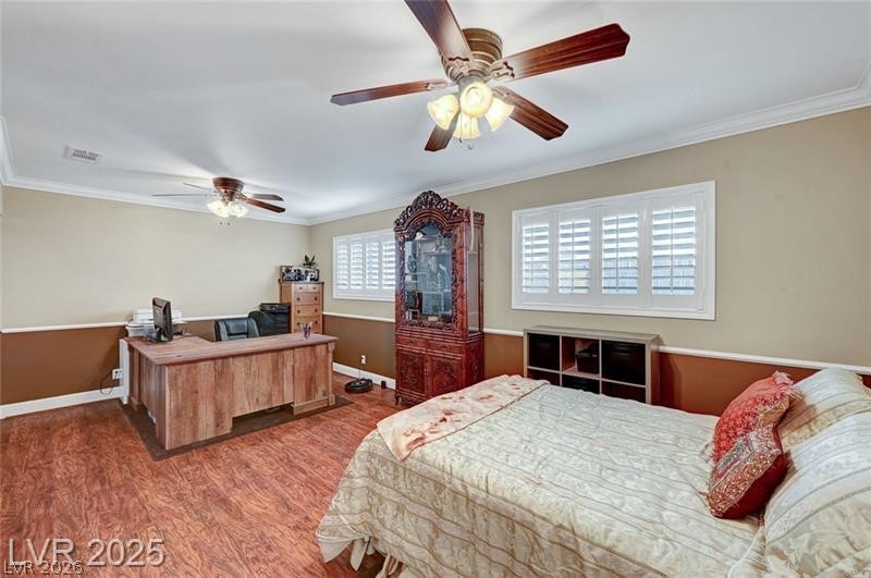 2410 Doherty Way Henderson, NV 89014 - Photo 36 of 63 Bedroom with crown molding, wood finished floors, baseboards, ceiling fan, and an office area