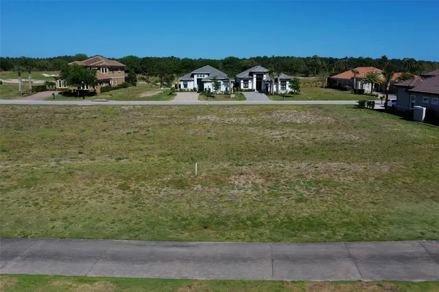 a view of a swimming pool with a yard