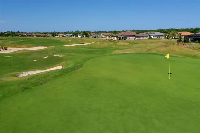 an aerial view of a houses with outdoor space