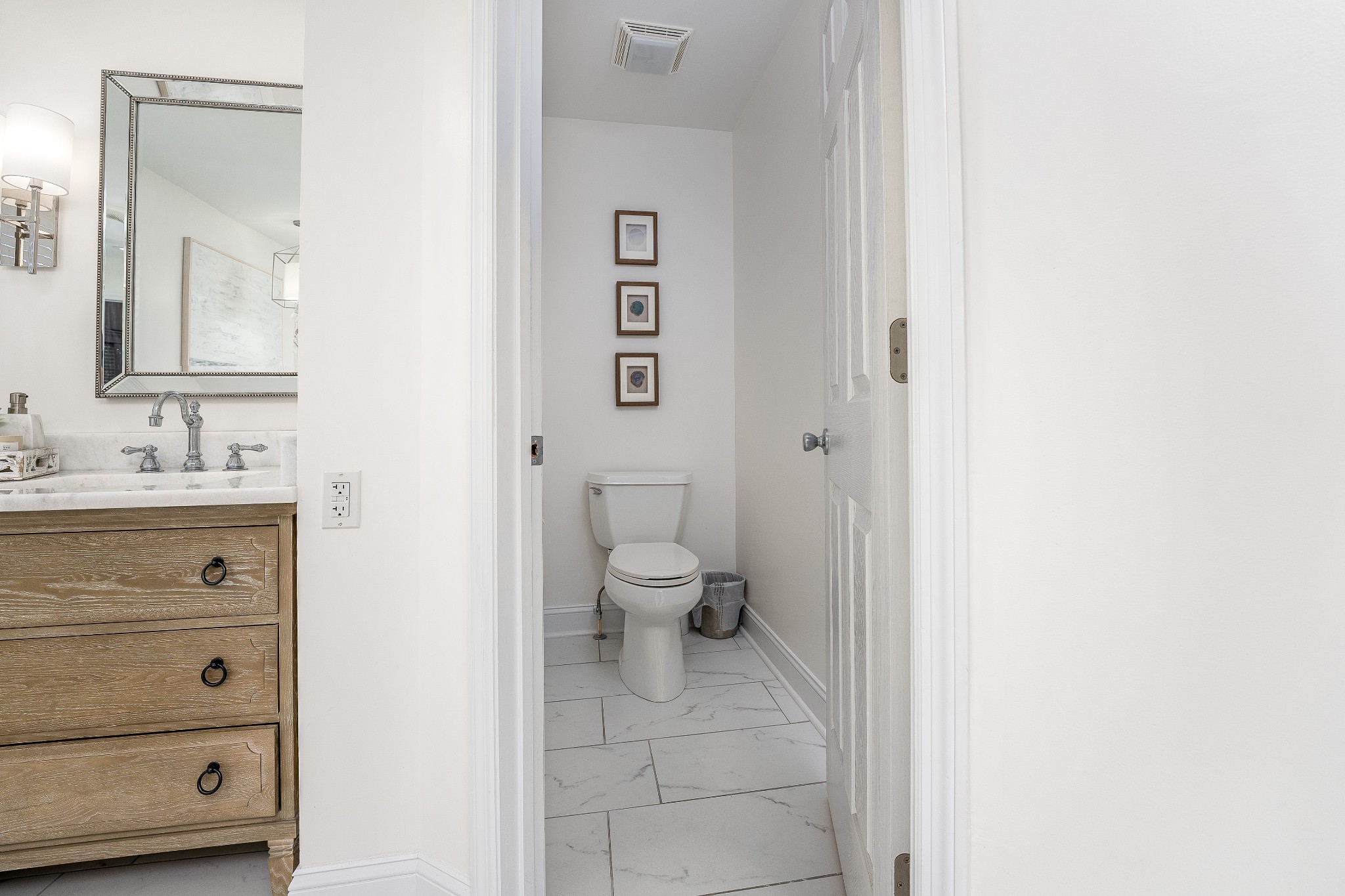 4901 Toll Dugger Road Culleoka, TN 38451 - Photo 25 of 68 a bathroom with a toilet sink and a mirror