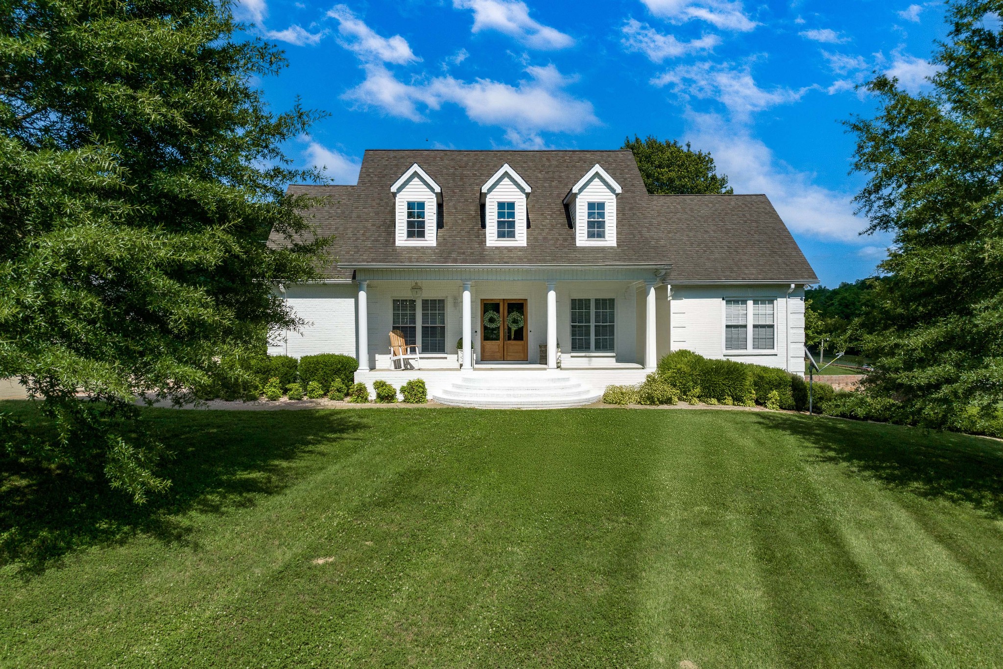 4901 Toll Dugger Road Culleoka, TN 38451 - Photo 4 of 68 a front view of a house with a garden