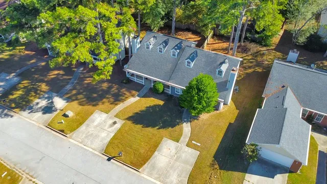 an aerial view of a house with swimming pool