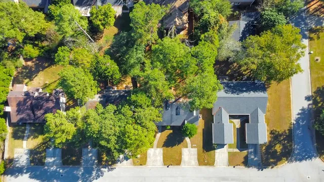 a view of a house with a flower garden