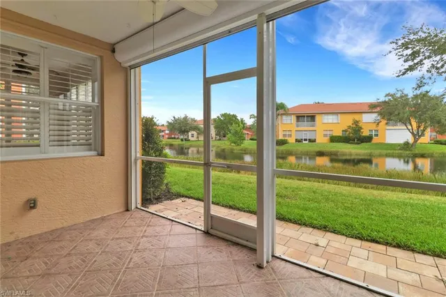 a view of a room with a big yard