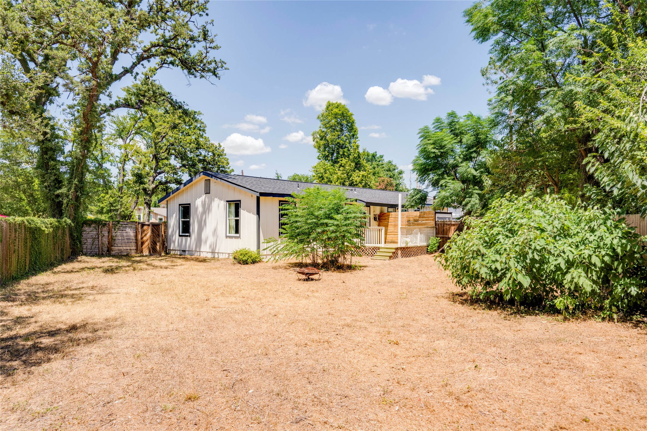 1400 Marcus Place, Unit B Austin, TX 78721 - Photo 36 of 39 A spacious yard surrounds this charming residence, offering a serene escape and ample room for outdoor activities.