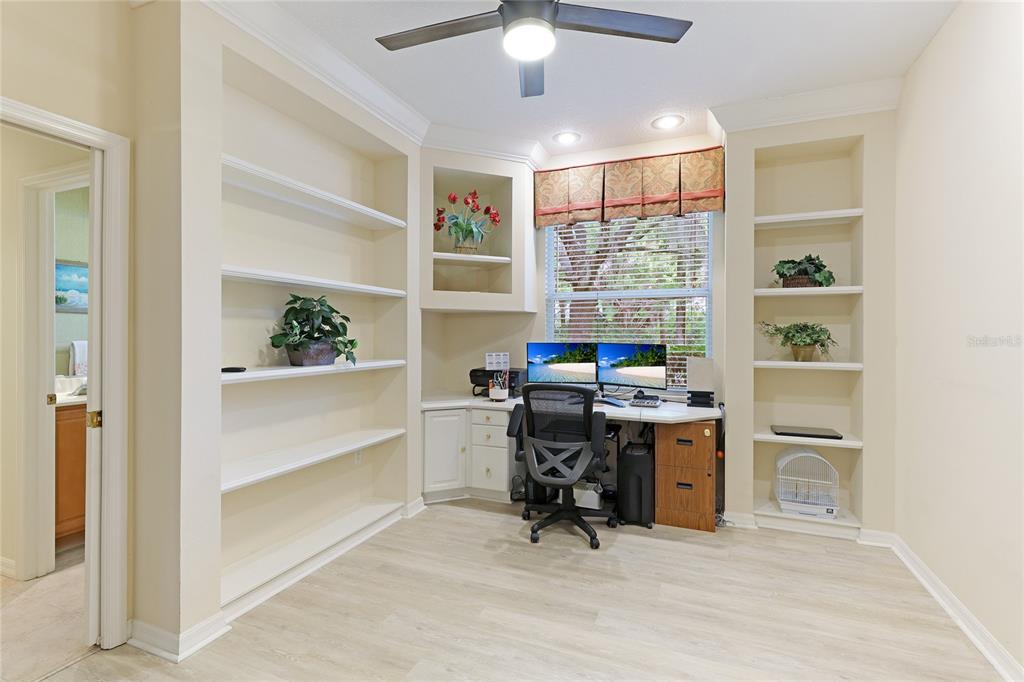 6103 Aviary Court Bradenton, FL 34203 - Photo 17 of 38 a view of a workspace with furniture and a window