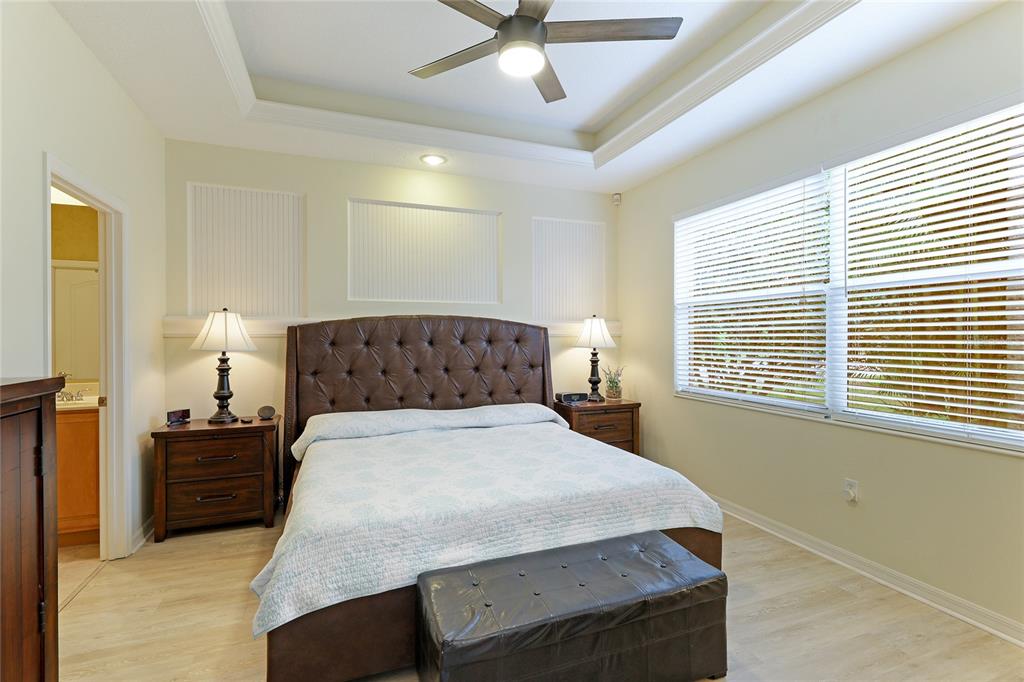 6103 Aviary Court Bradenton, FL 34203 - Photo 19 of 38 a bedroom with a bed and window
