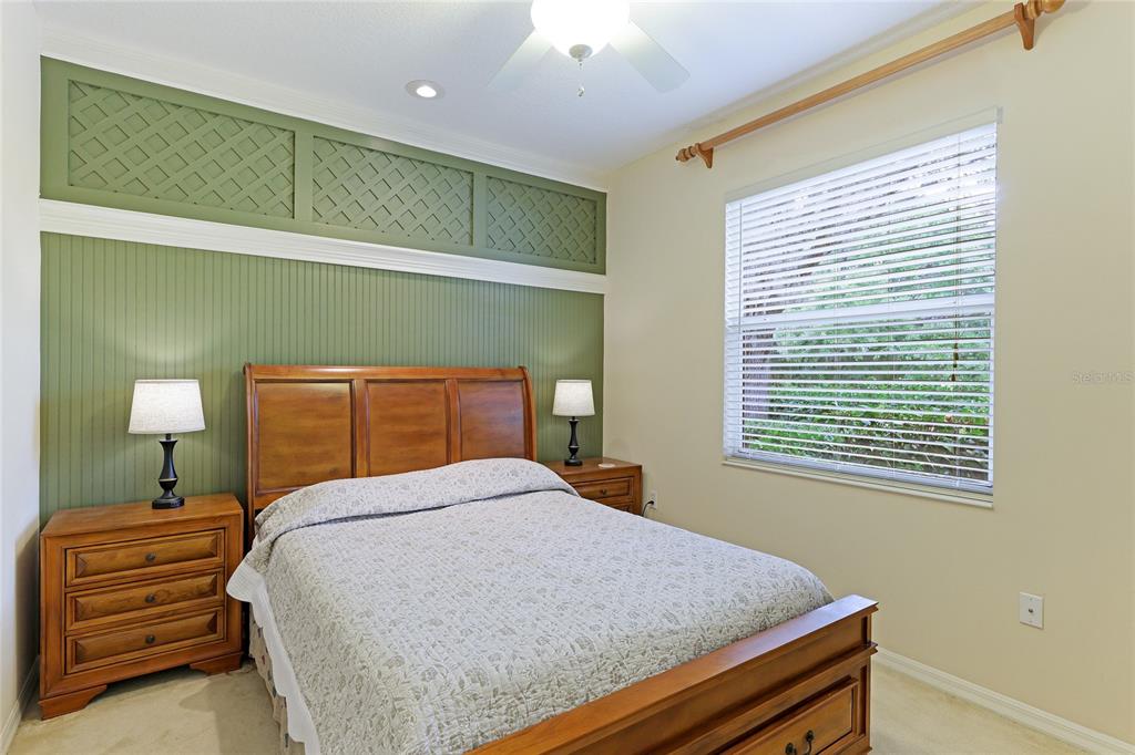 6103 Aviary Court Bradenton, FL 34203 - Photo 23 of 38 a bedroom with a bed and a window