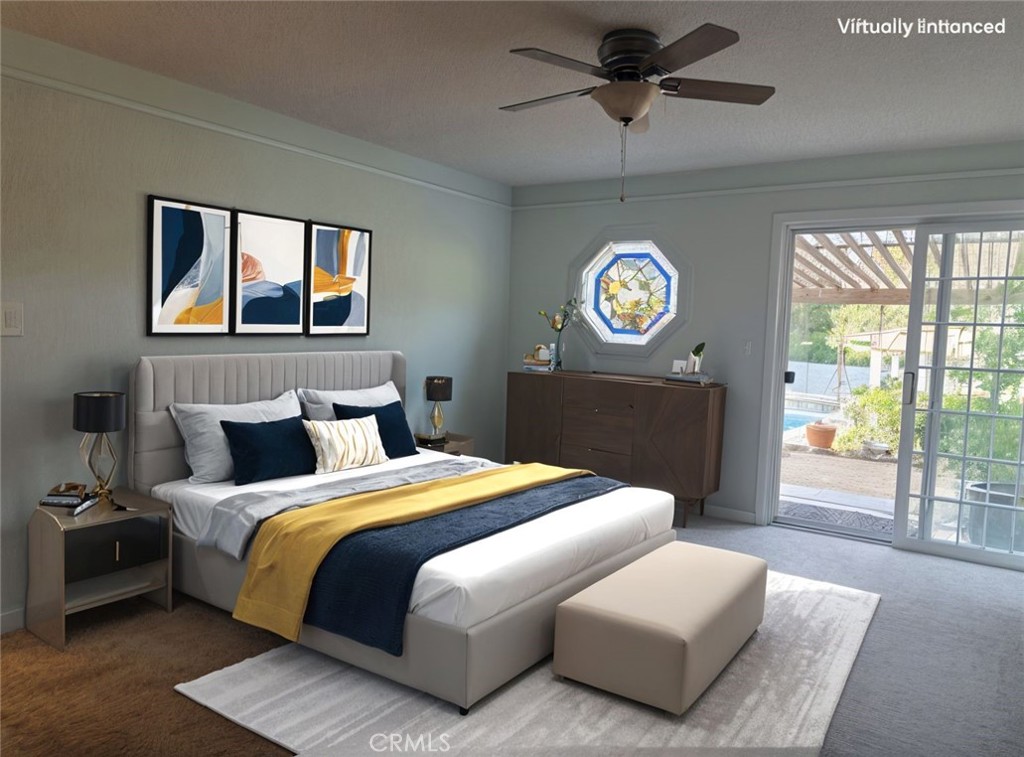 4504 Eickhoff Road Lakeport, CA 95453 - Photo 11 of 40 a bedroom with a bed and a table in it with window