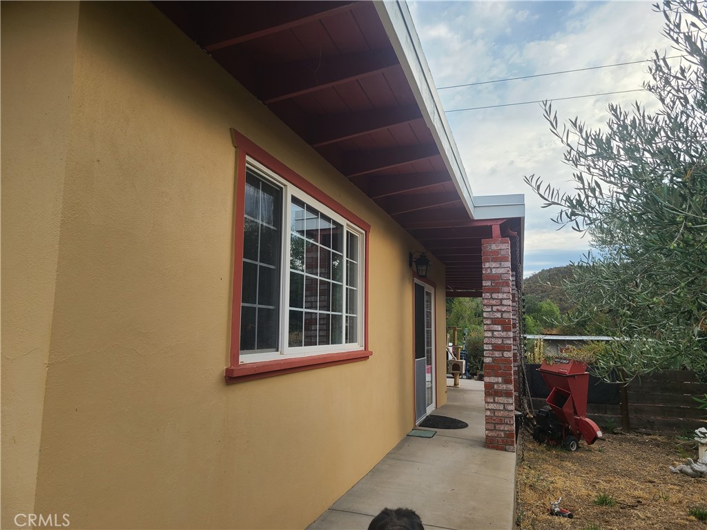 4504 Eickhoff Road Lakeport, CA 95453 - Photo 21 of 40 a balcony with furniture and a window