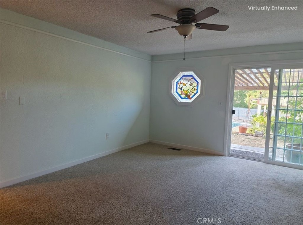 4504 Eickhoff Road Lakeport, CA 95453 - Photo 10 of 40 an empty room with a window and a ceiling fan