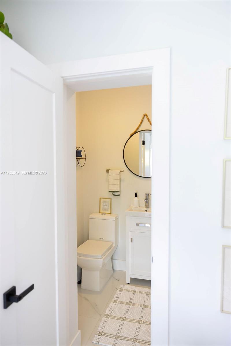 3205 Southwest 68th Avenue Miami, FL 33155 - Photo 27 of 33 a bathroom with a toilet a sink and bathtub