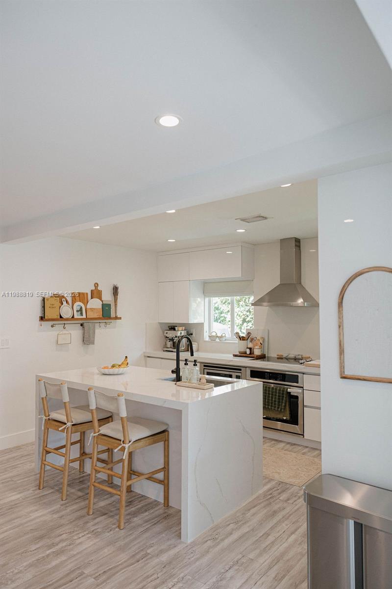 3205 Southwest 68th Avenue Miami, FL 33155 - Photo 8 of 33 a kitchen with a table and chairs in it