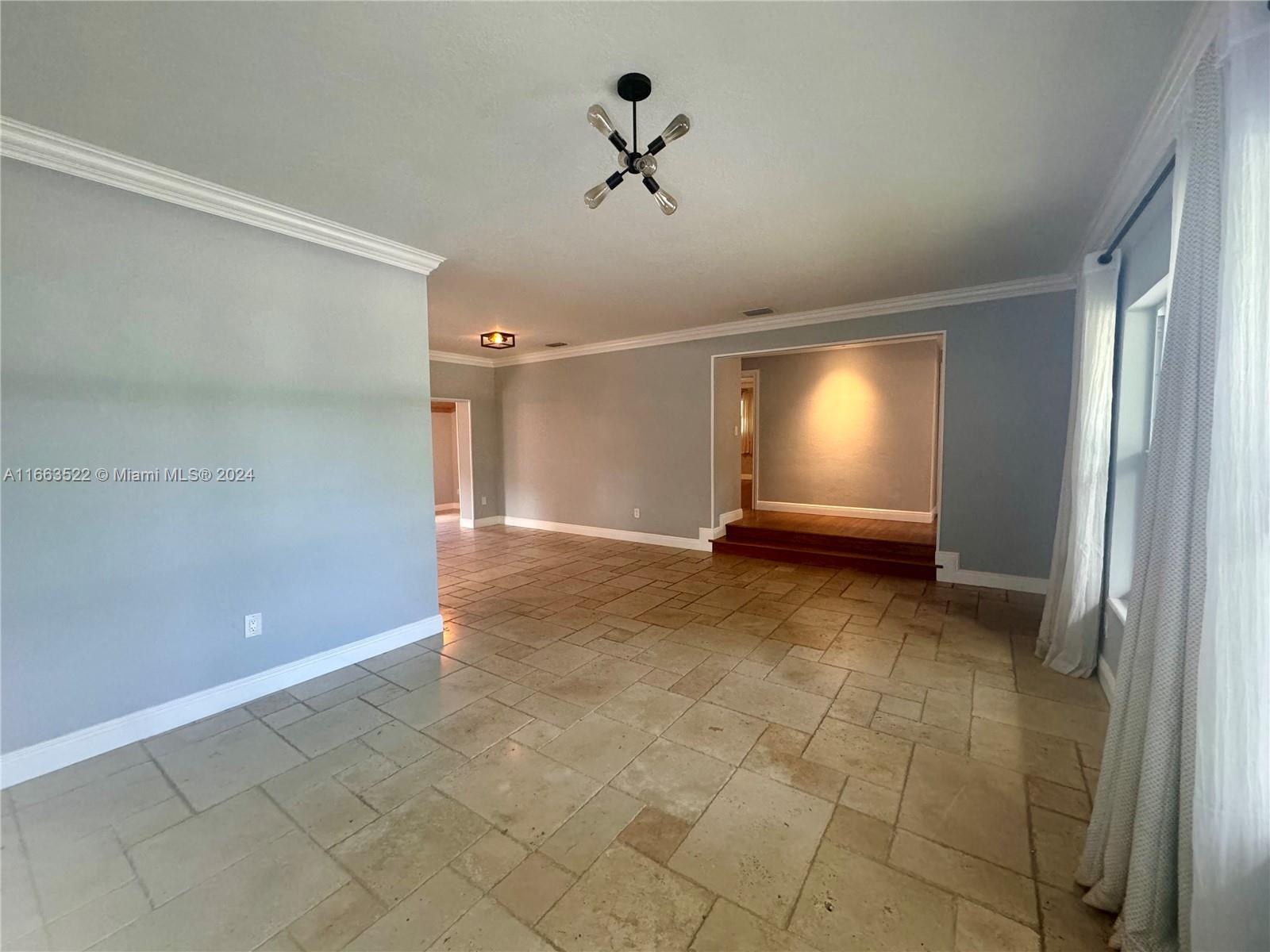 8945 Southwest 125th Terrace, Unit 8945 Miami, FL 33176 - Photo 1 of 29 a view of an empty room with a window