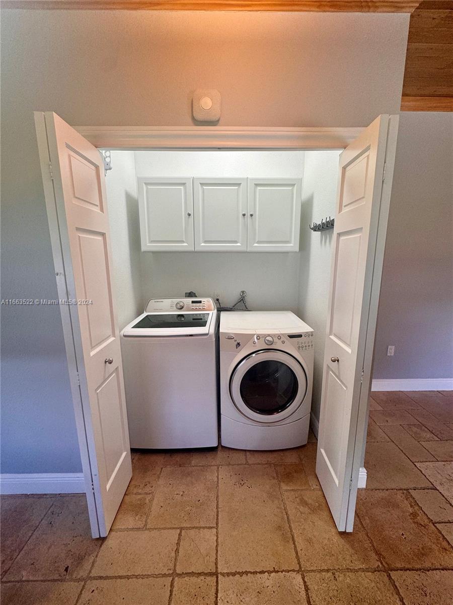 8945 Southwest 125th Terrace, Unit 8945 Miami, FL 33176 - Photo 14 of 29 a utility room with dryer and washer