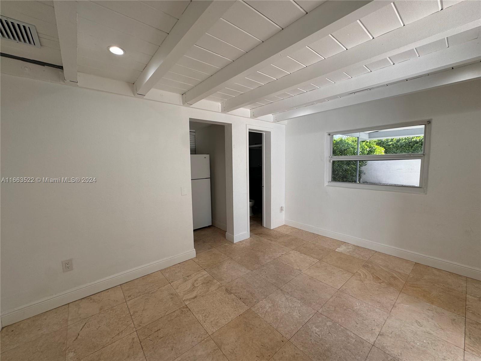 8945 Southwest 125th Terrace, Unit 8945 Miami, FL 33176 - Photo 17 of 29 an empty room with windows