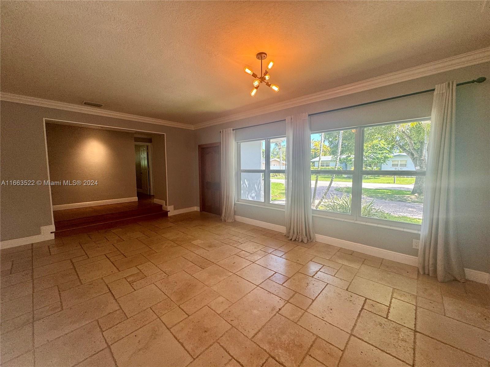 8945 Southwest 125th Terrace, Unit 8945 Miami, FL 33176 - Photo 2 of 29 a view of an empty room with a window