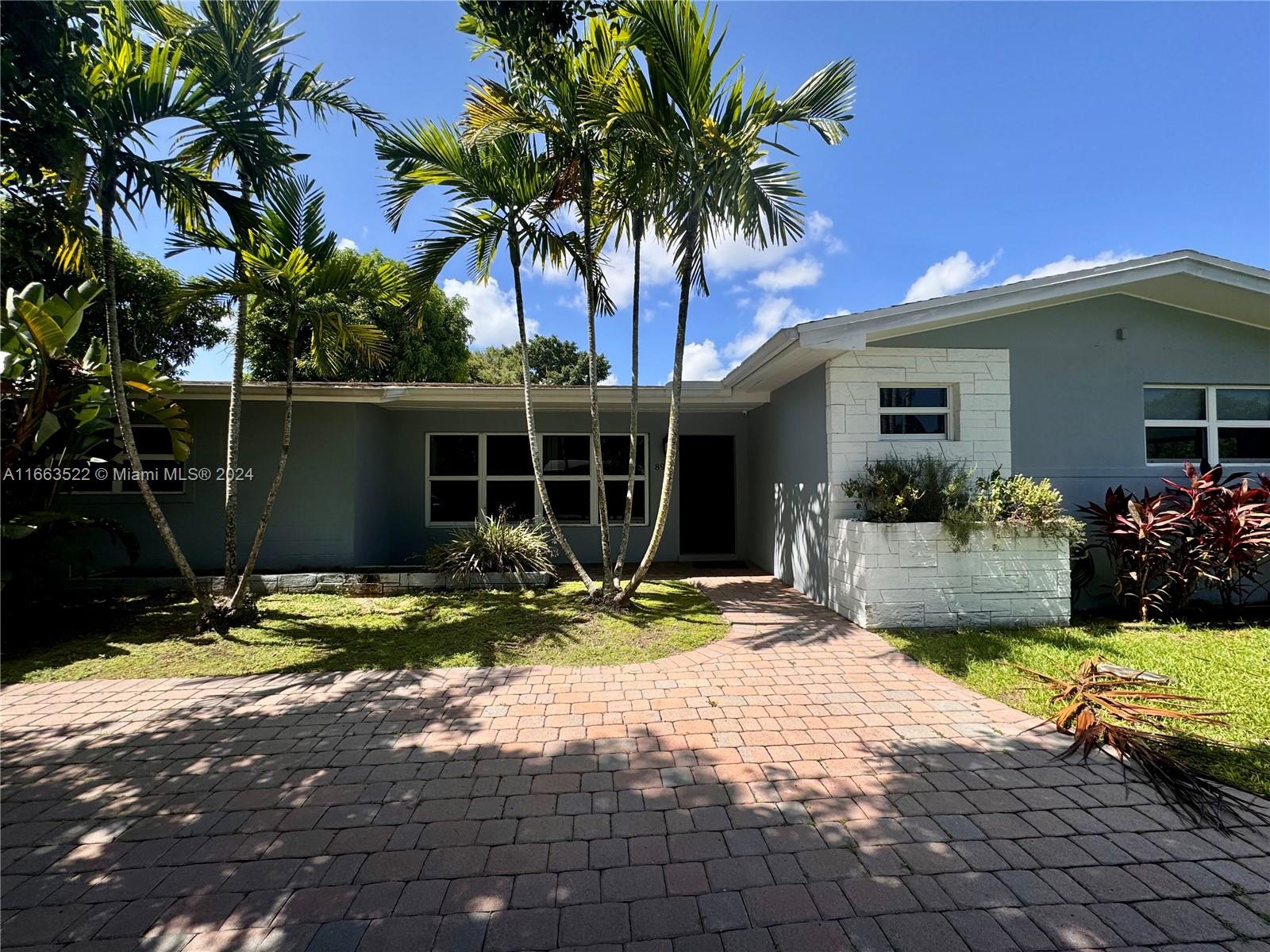 8945 Southwest 125th Terrace, Unit 8945 Miami, FL 33176 - Photo 22 of 29 a house with yard in front of it