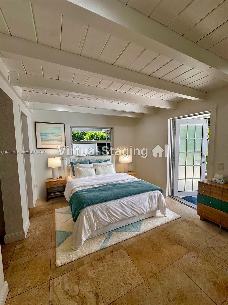 8945 Southwest 125th Terrace, Unit 8945 Miami, FL 33176 - Photo 26 of 29 a bedroom with a bed couch and a window