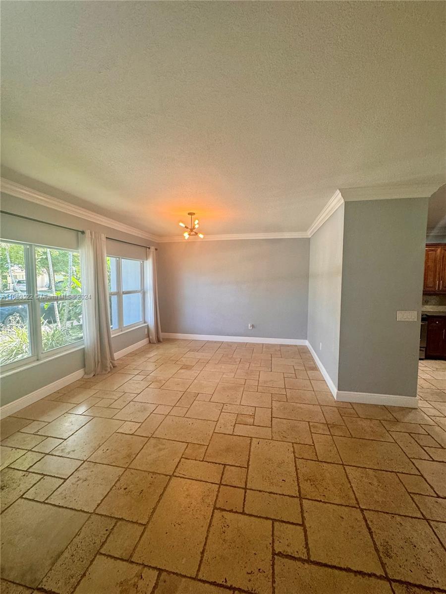 8945 Southwest 125th Terrace, Unit 8945 Miami, FL 33176 - Photo 4 of 29 a view of an empty room and window