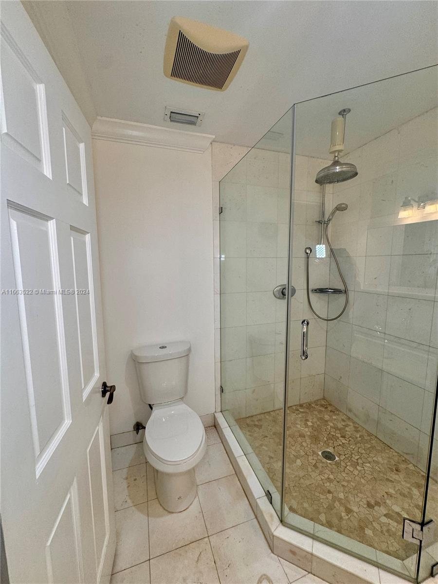 8945 Southwest 125th Terrace, Unit 8945 Miami, FL 33176 - Photo 10 of 29 a bathroom with a toilet and a shower