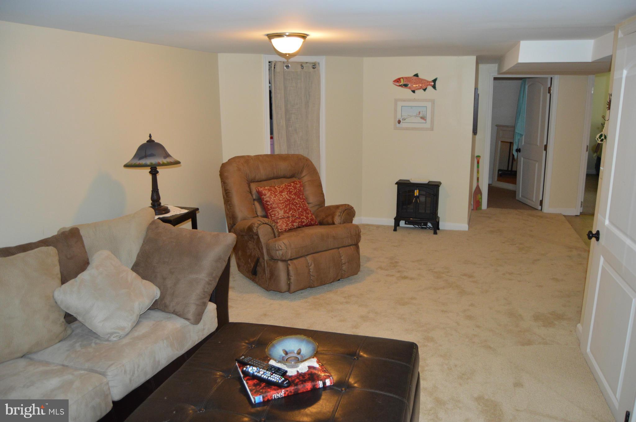 8471 Church Road Pasadena, MD 21122 - Photo 12 of 18 a living room with furniture and a couch
