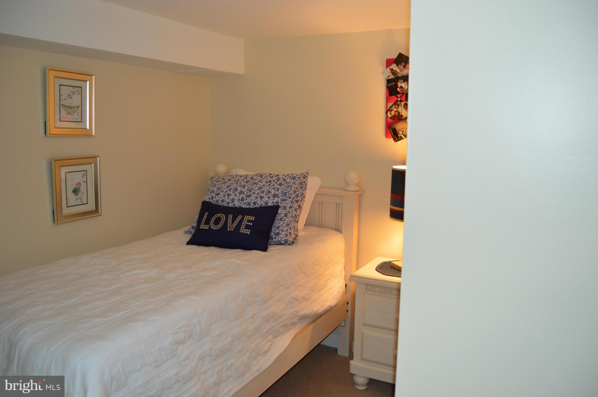 8471 Church Road Pasadena, MD 21122 - Photo 15 of 18 a bedroom with a bed and a wall painting