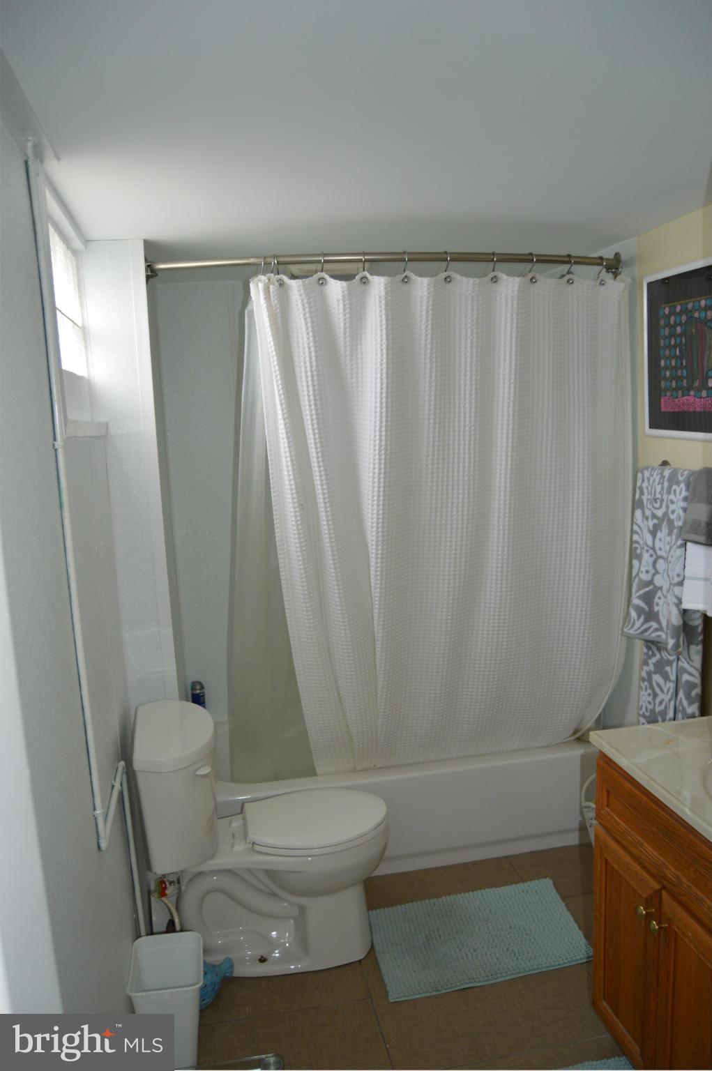 8471 Church Road Pasadena, MD 21122 - Photo 16 of 18 a bathroom with a sink and a mirror