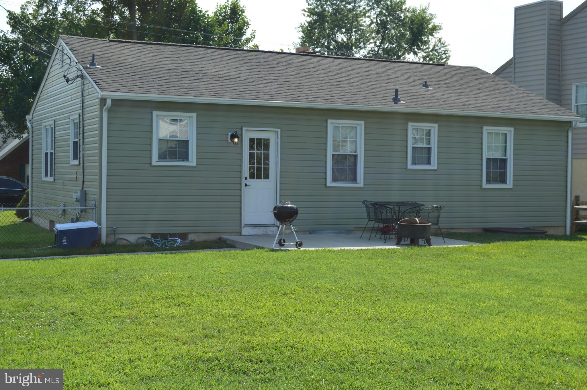 8471 Church Road Pasadena, MD 21122 - Photo 17 of 18 a house that has a backyard