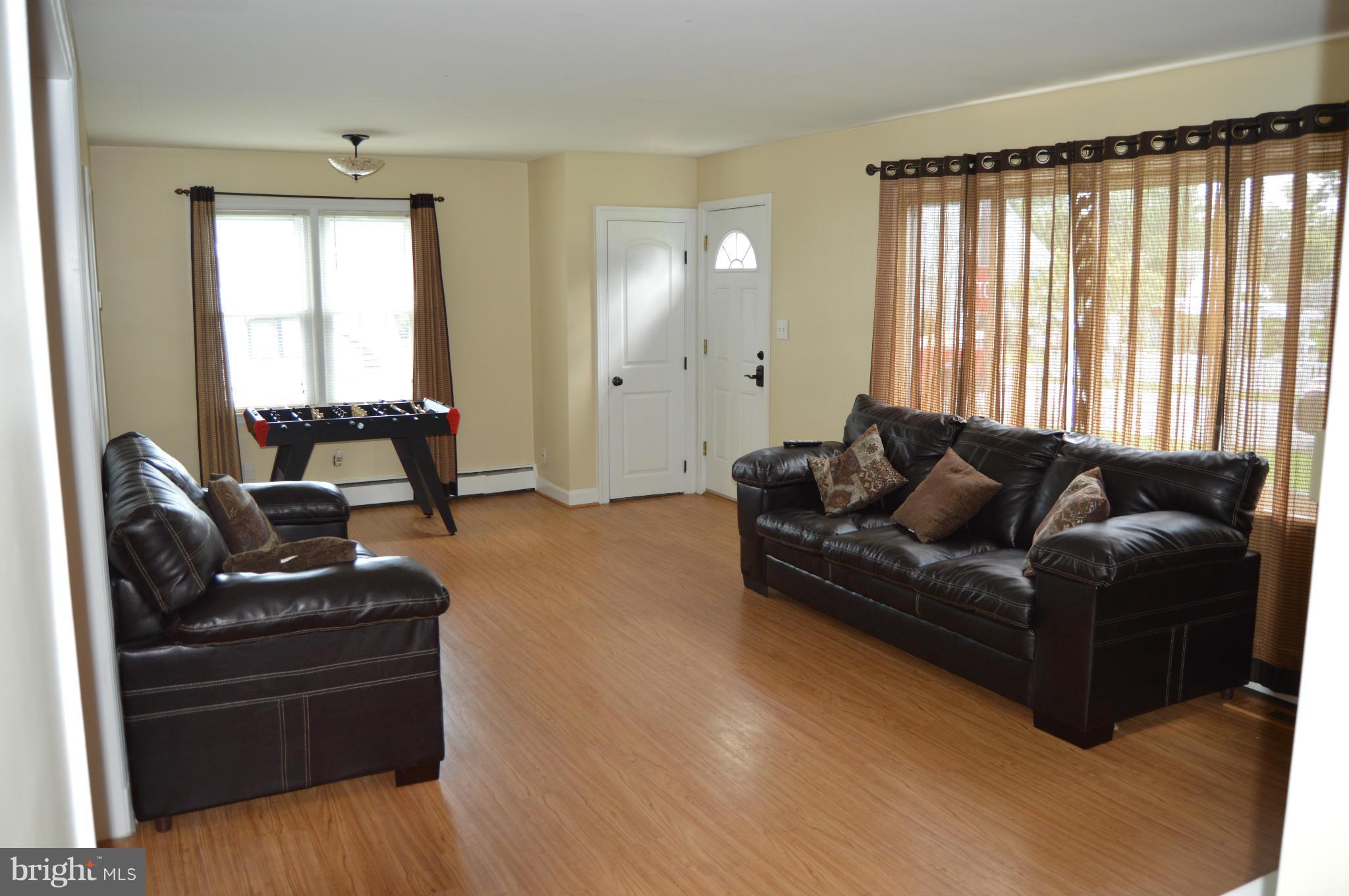 8471 Church Road Pasadena, MD 21122 - Photo 3 of 18 a living room with furniture and a large window