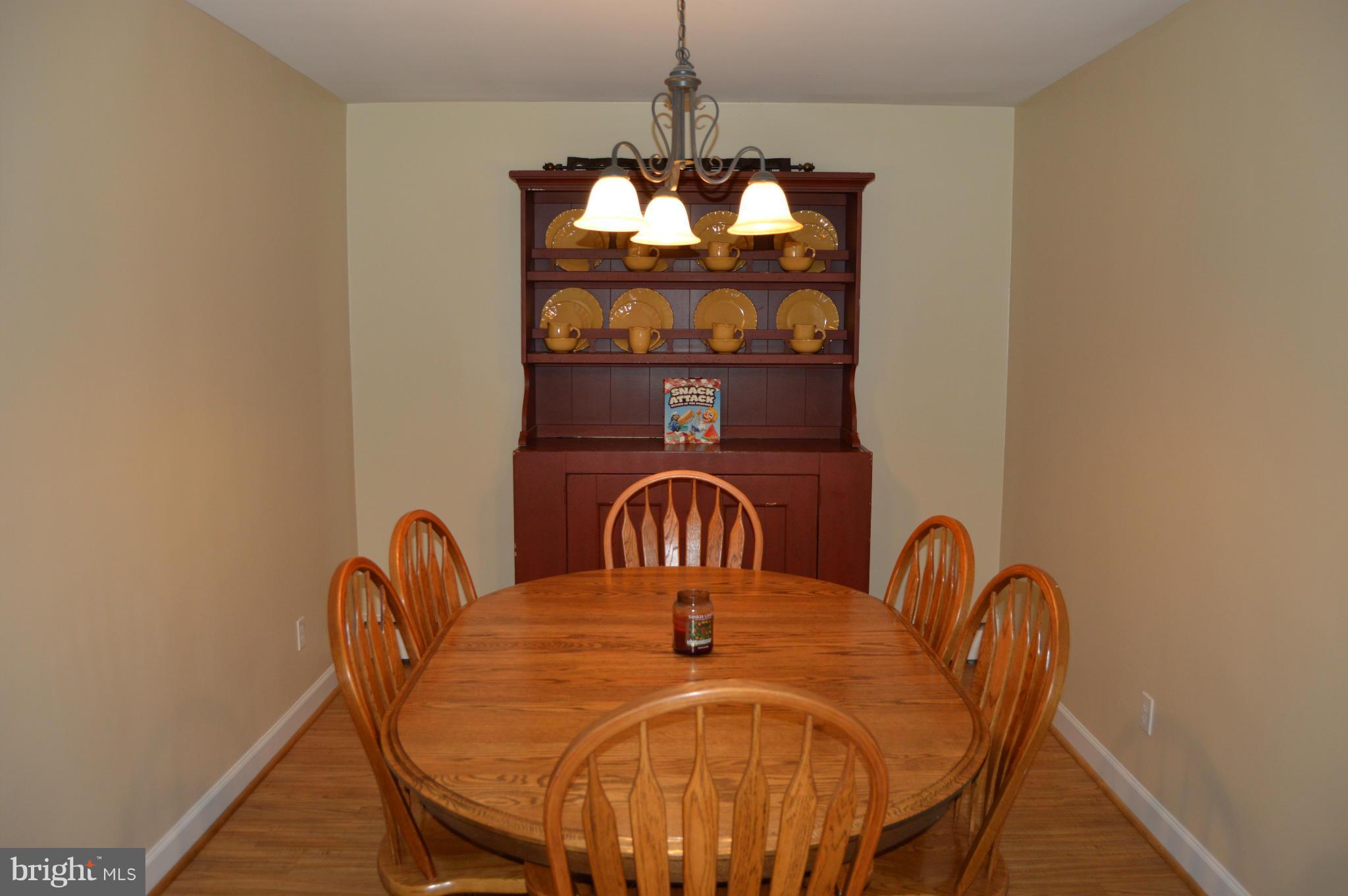 8471 Church Road Pasadena, MD 21122 - Photo 6 of 18 a table and chairs in a balcony