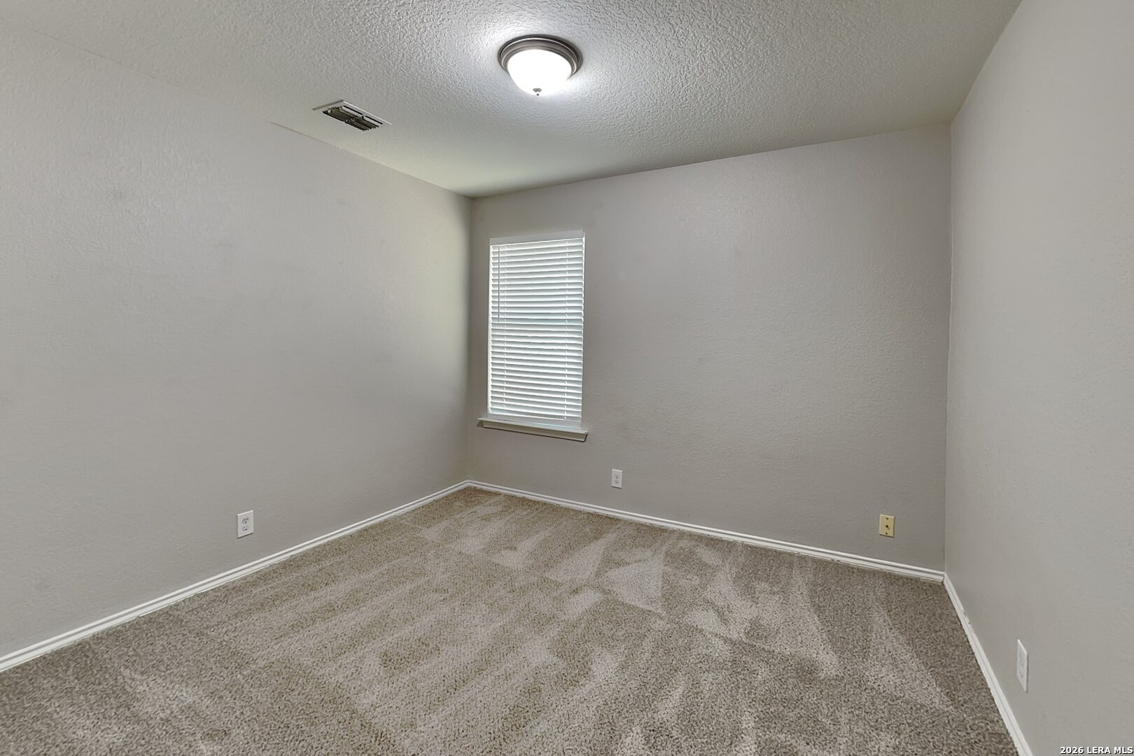 6510 Poseidon Way Converse, TX 78109 - Photo 11 of 16 an empty room with a window