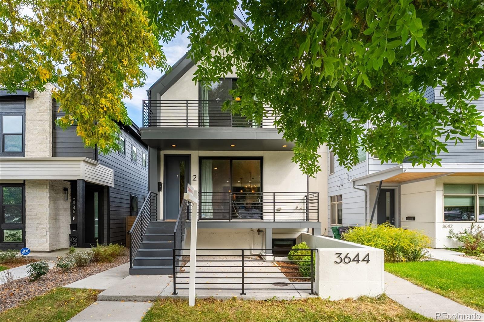 3644 Quivas Street, Unit 2 Denver, CO 80211 - Photo 1 of 49 front view of a house with a yard