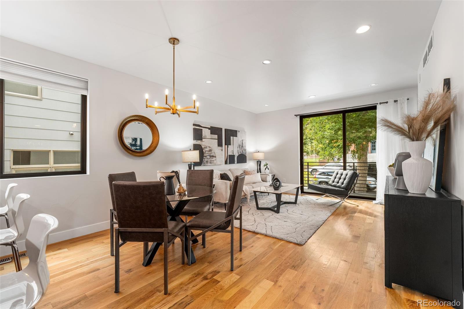 3644 Quivas Street, Unit 2 Denver, CO 80211 - Photo 11 of 49 a view of a dining room with furniture window and wooden floor