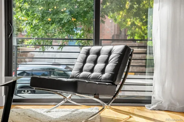 a view of a chair and table in a livingroom