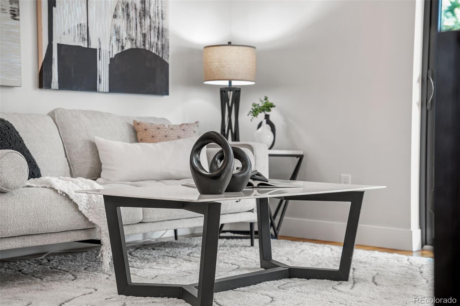 3644 Quivas Street, Unit 2 Denver, CO 80211 - Photo 13 of 49 a view of a chair and table in a livingroom